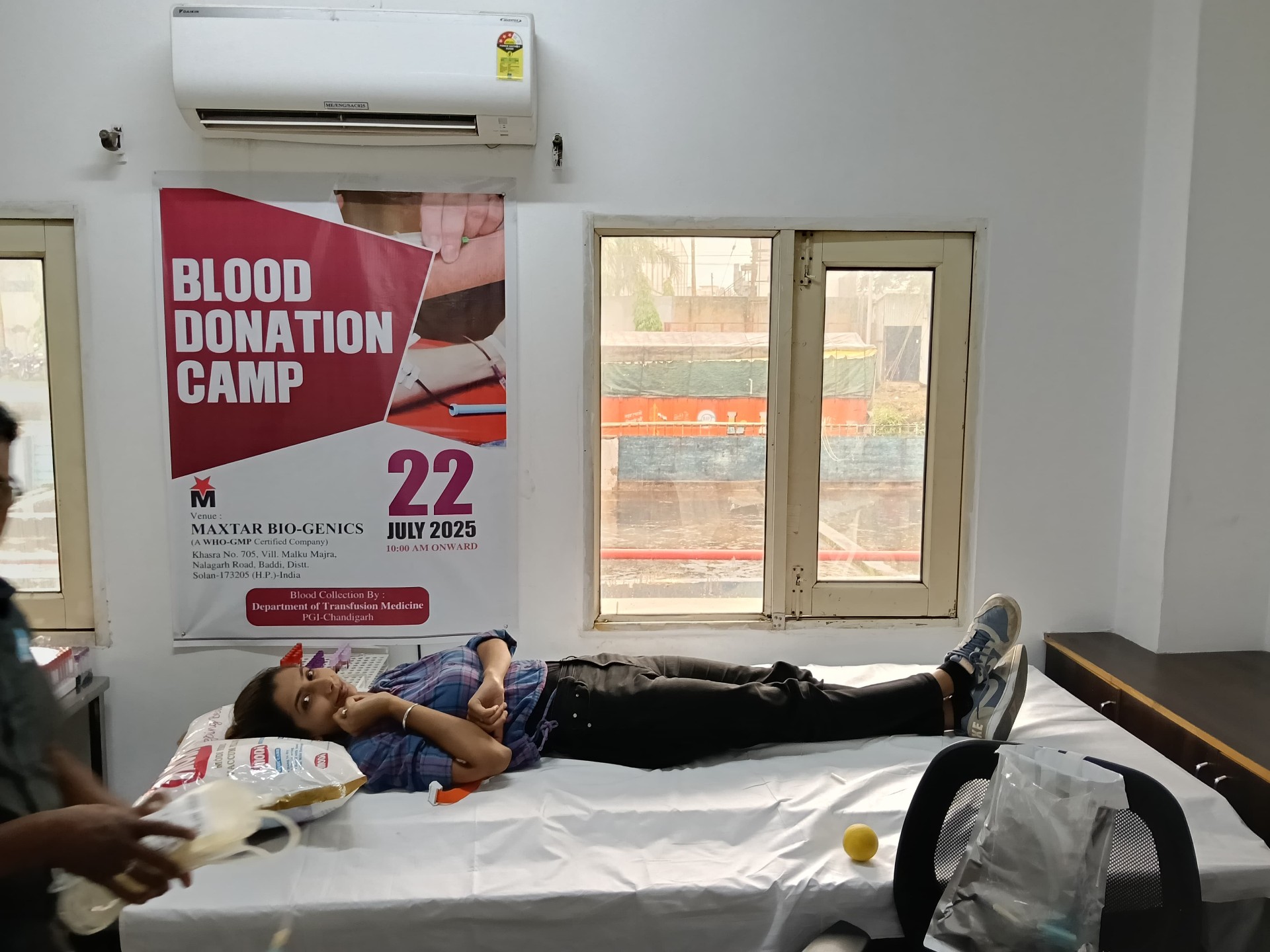 Donor resting at Arika Healthcare Blood Donation Camp under official banner