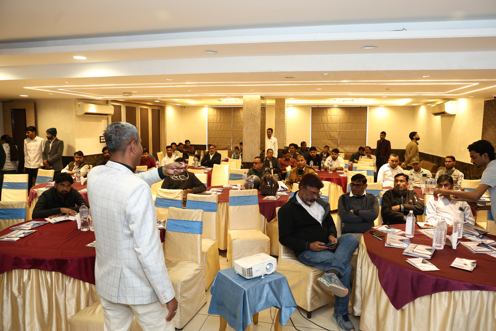 Arika leadership addressing distributors at a partner conference