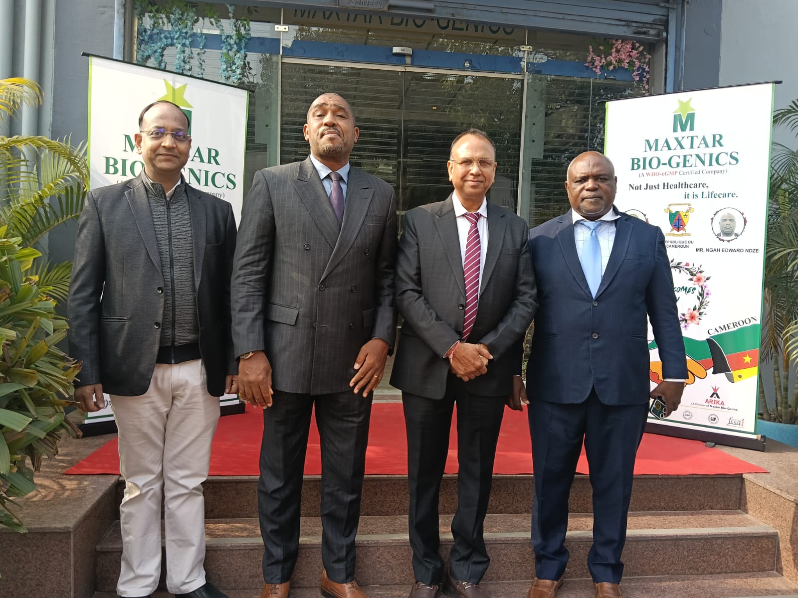 Cameroon delegation with Arika leadership at facility entrance