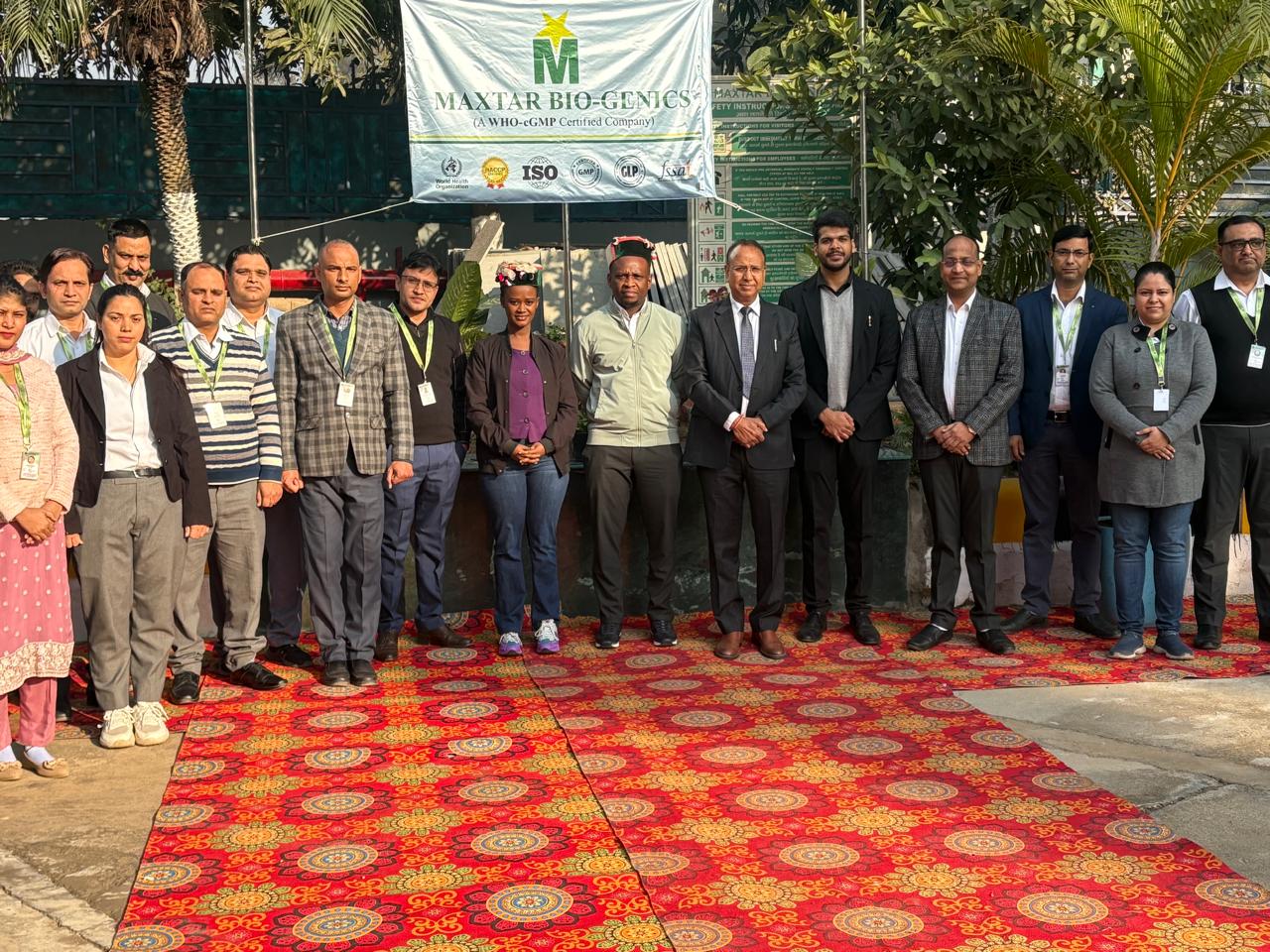 Team group photo under Maxtar Bio-Genics banner with African delegates