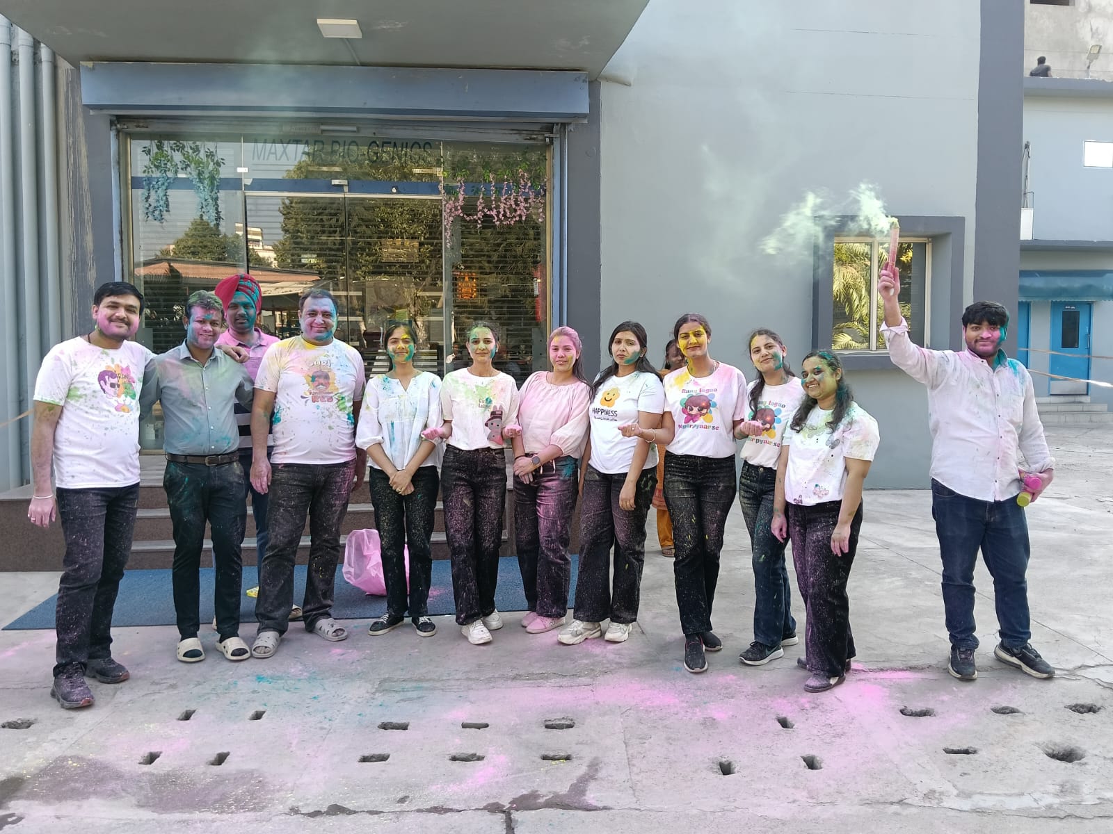 Team celebrating Holi outside the facility