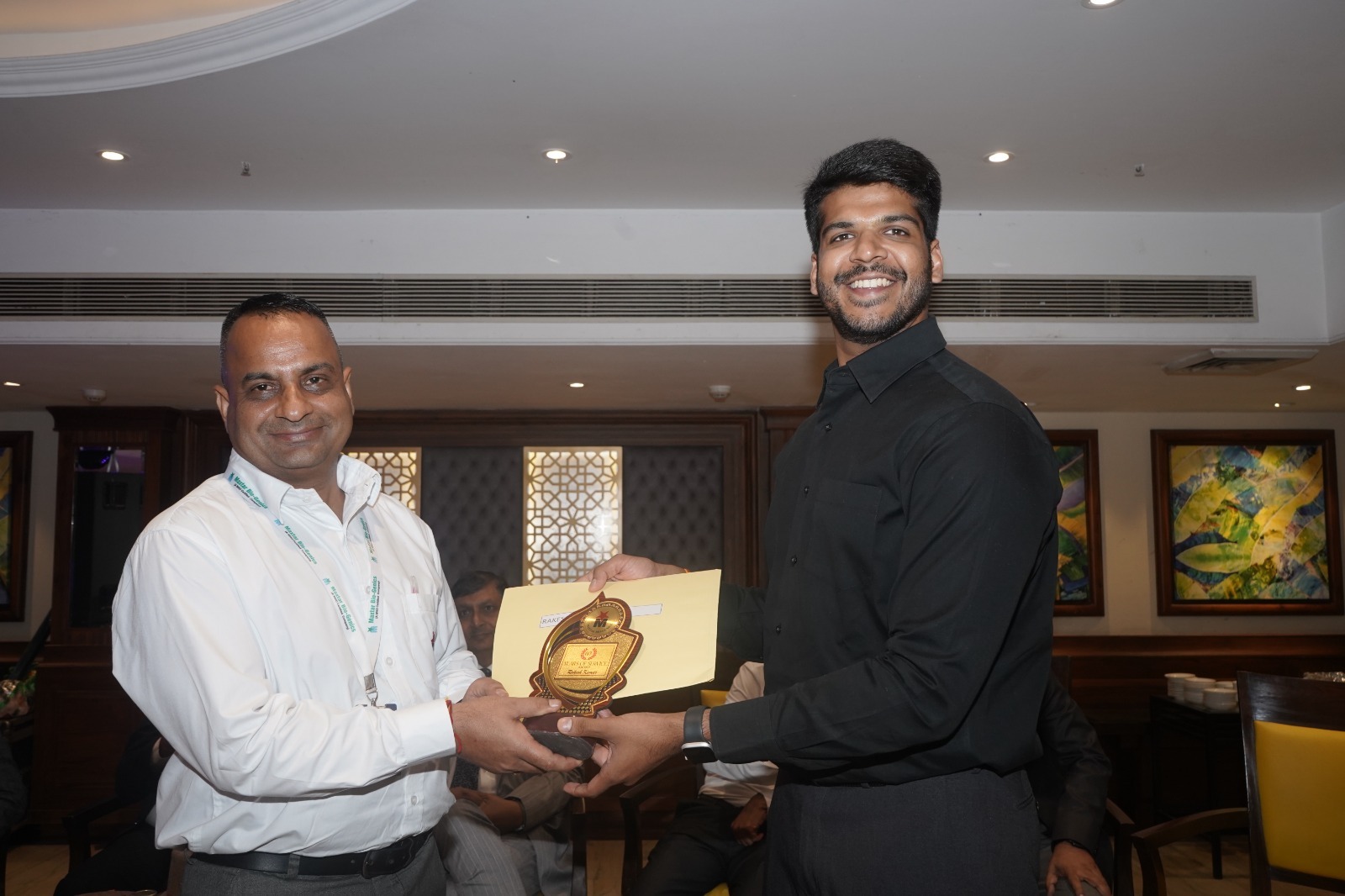 Years-of-service award presentation to a Maxtar team member