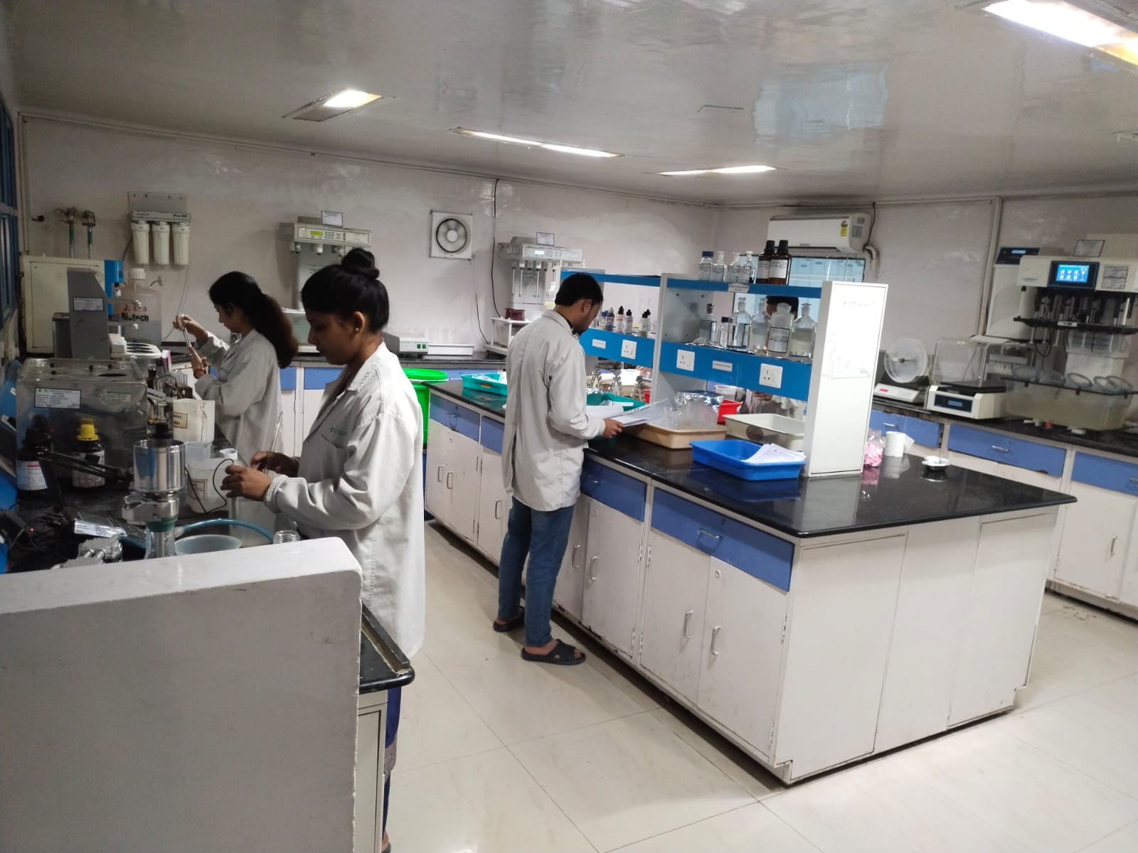 Lab technicians performing wet chemistry